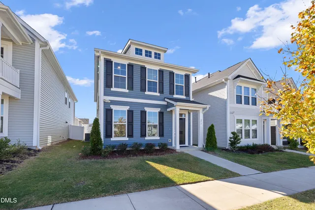 a view of a house with swimming pool and porch
