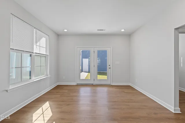 a view of kitchen with wooden floor and electronic appliances