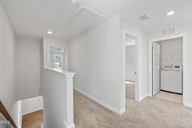 a view of an empty room with windows