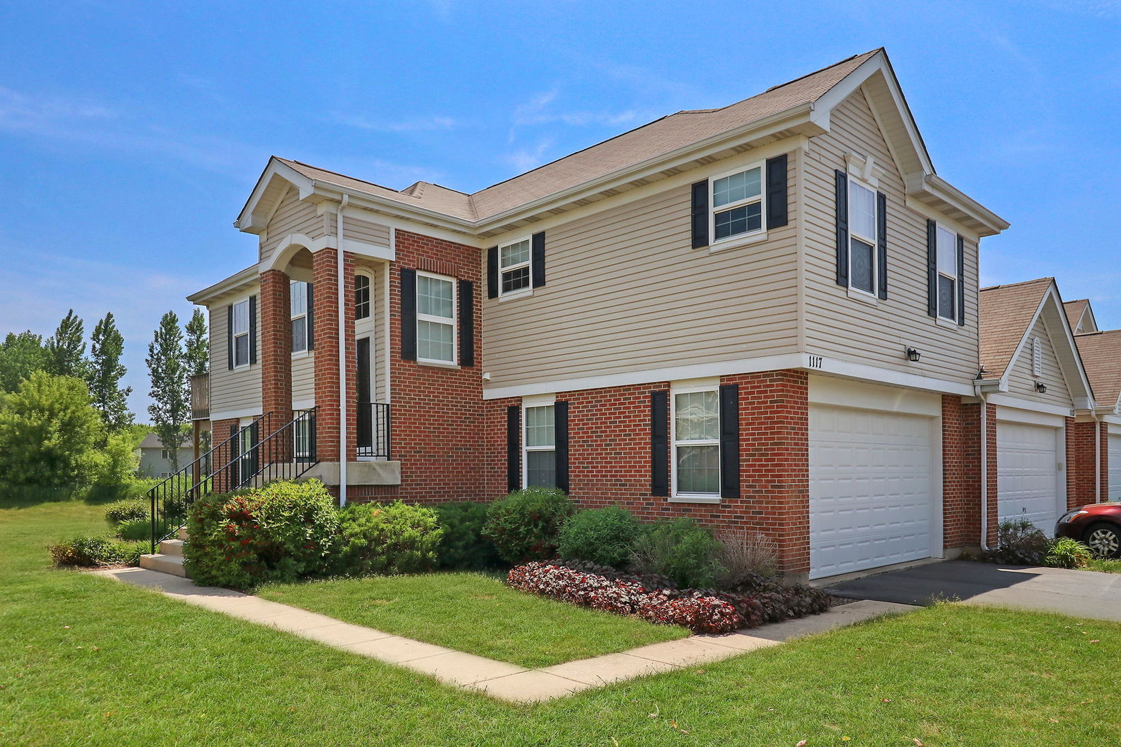 1117 Draper Road McHenry, IL 60050 - Photo 1 of 26 a front view of a house with a yard
