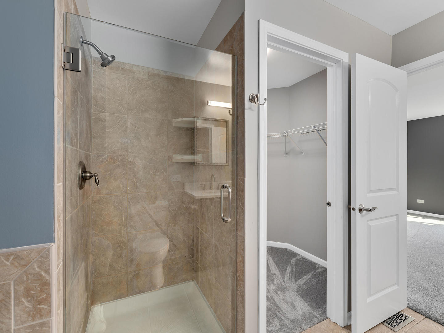 1117 Draper Road McHenry, IL 60050 - Photo 14 of 26 a bathroom with a shower and a glass door