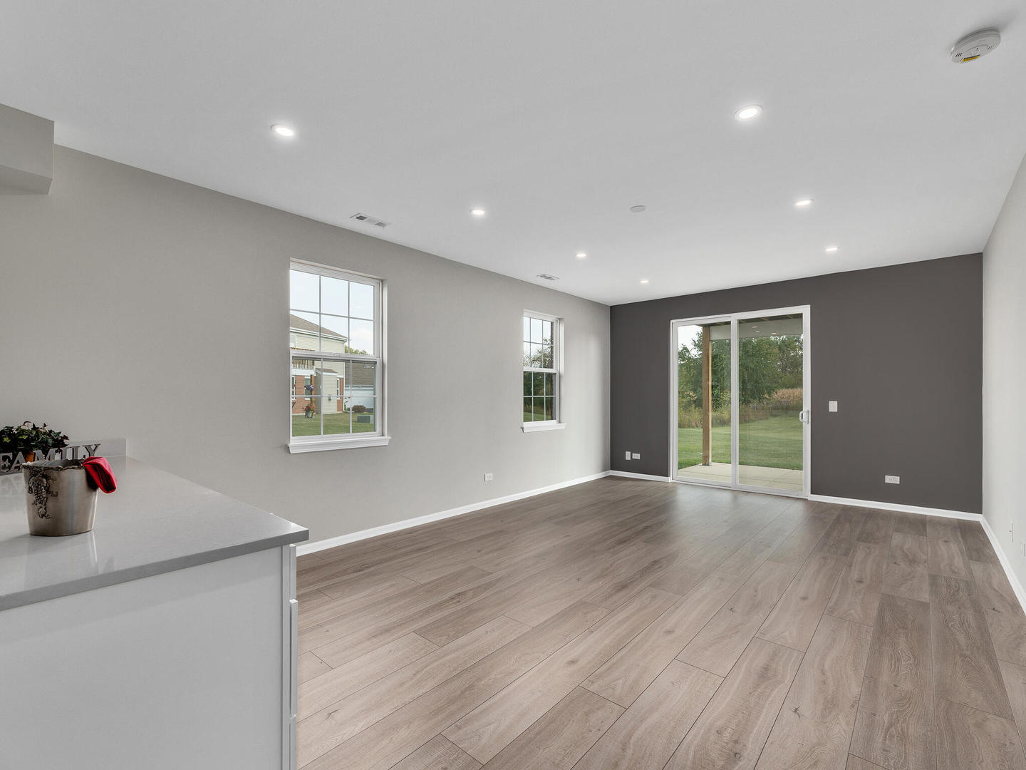 1117 Draper Road McHenry, IL 60050 - Photo 20 of 26 a view of an empty room with wooden floor and a window