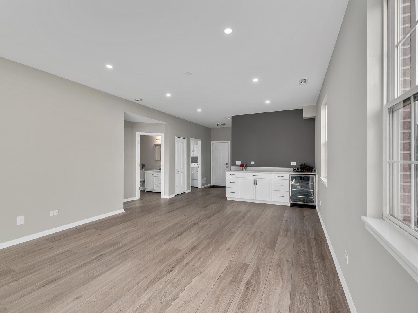 1117 Draper Road McHenry, IL 60050 - Photo 21 of 26 a view of a big room with wooden floor and windows