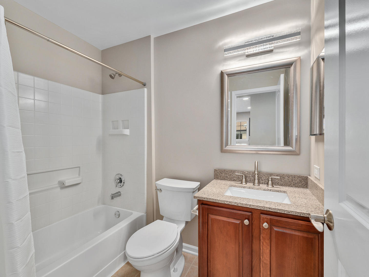 1117 Draper Road McHenry, IL 60050 - Photo 22 of 26 a bathroom with a sink toilet and shower