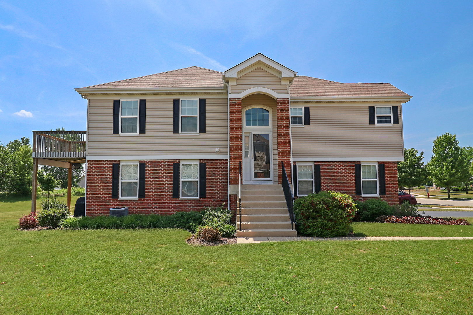 1117 Draper Road McHenry, IL 60050 - Photo 3 of 26 a front view of a house with a yard