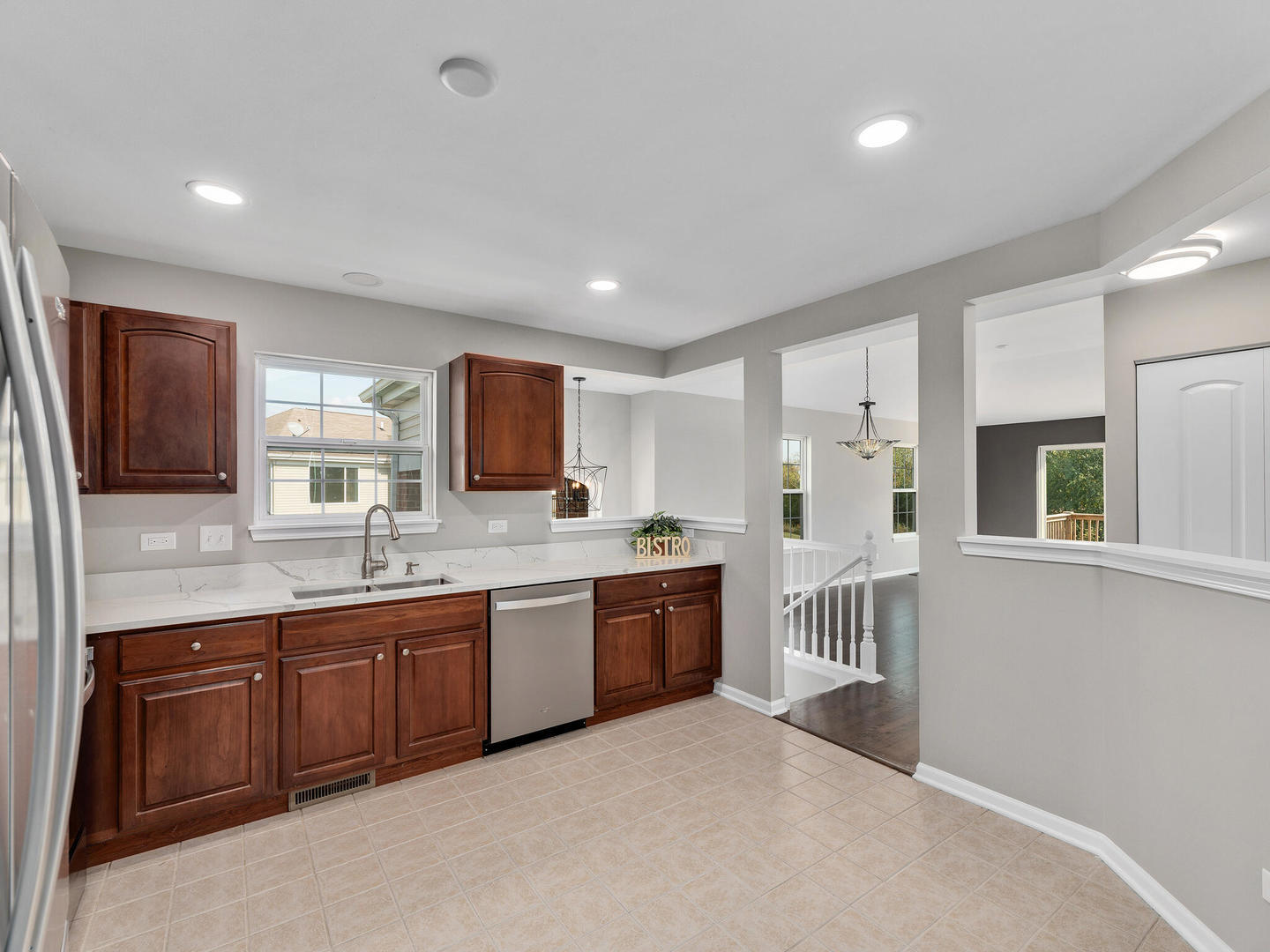 1117 Draper Road McHenry, IL 60050 - Photo 7 of 26 a large kitchen with a stove and a sink