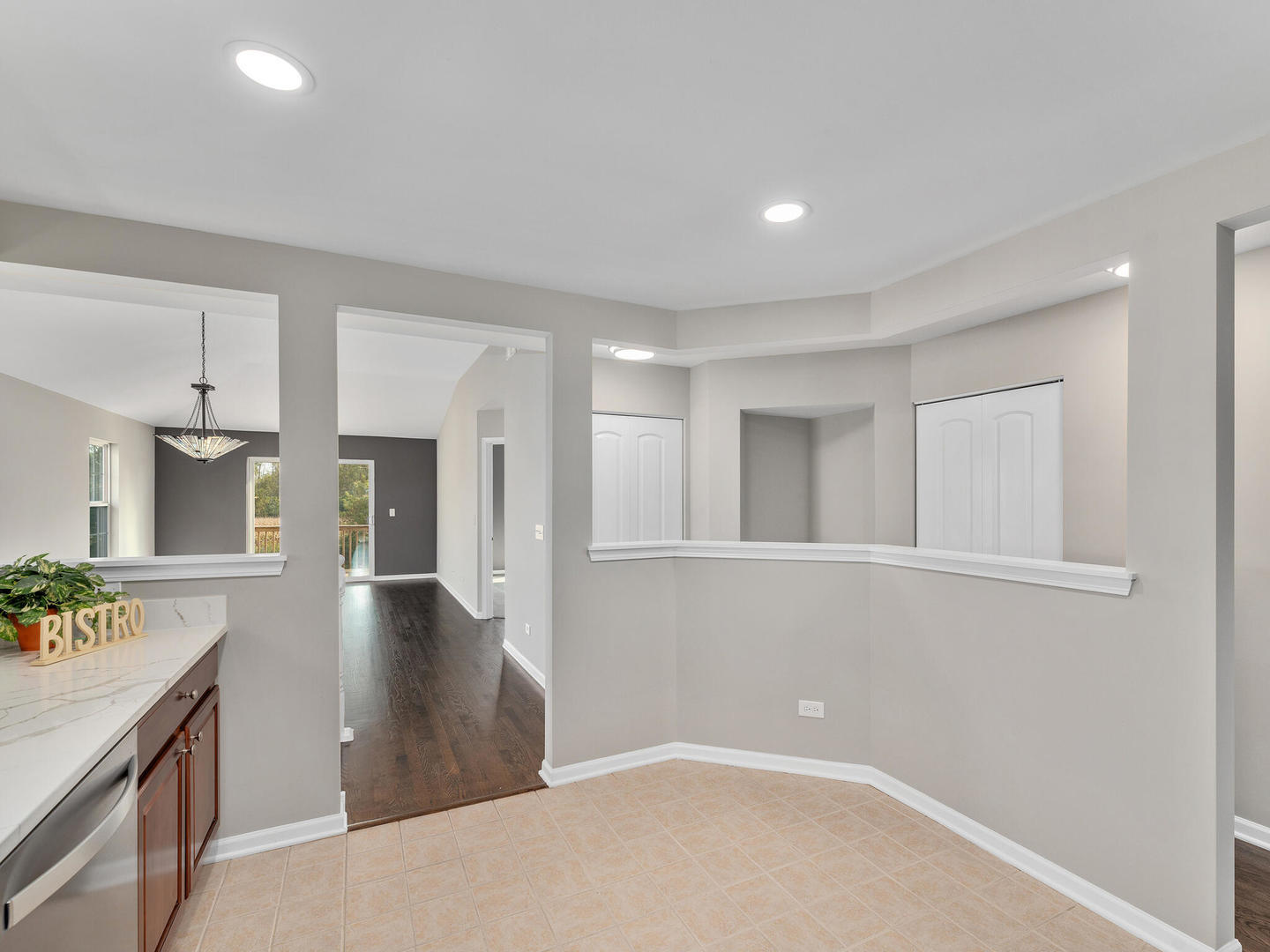 1117 Draper Road McHenry, IL 60050 - Photo 8 of 26 a view of a kitchen cabinets and a wooden floor
