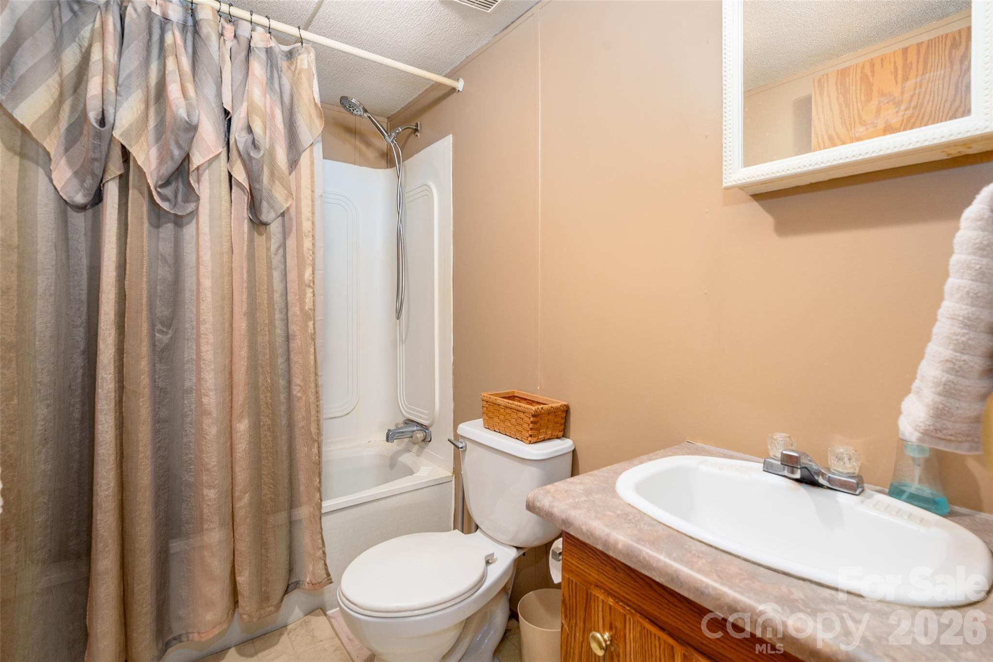 2748 Flat Creek Road Lancaster, SC 29720 - Photo 15 of 24 a bathroom with a granite countertop sink toilet and shower
