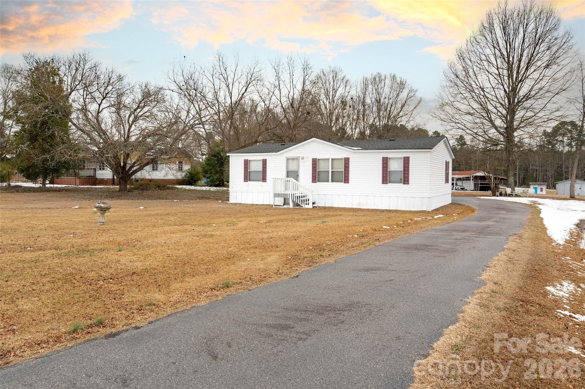 2748 Flat Creek Road Lancaster, SC 29720 - Photo 17 of 24 a front view of a house with trees