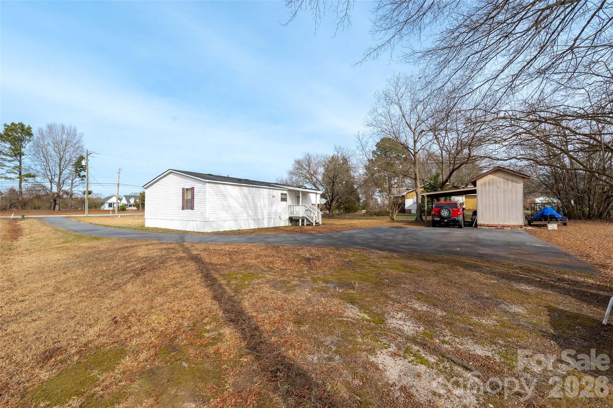 2748 Flat Creek Road Lancaster, SC 29720 - Photo 21 of 24 a street view with large trees