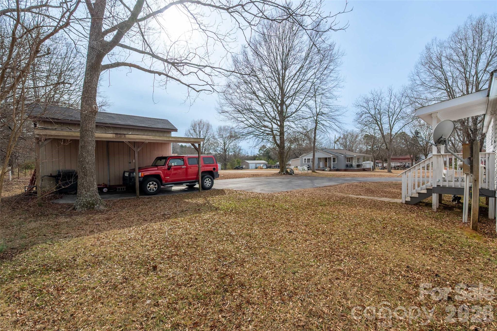 2748 Flat Creek Road Lancaster, SC 29720 - Photo 23 of 24 a red car parked in front of a house