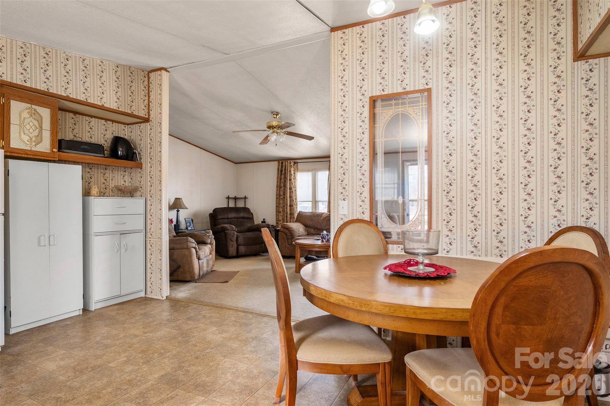 2748 Flat Creek Road Lancaster, SC 29720 - Photo 8 of 24 a view of a dining room with furniture and chandelier