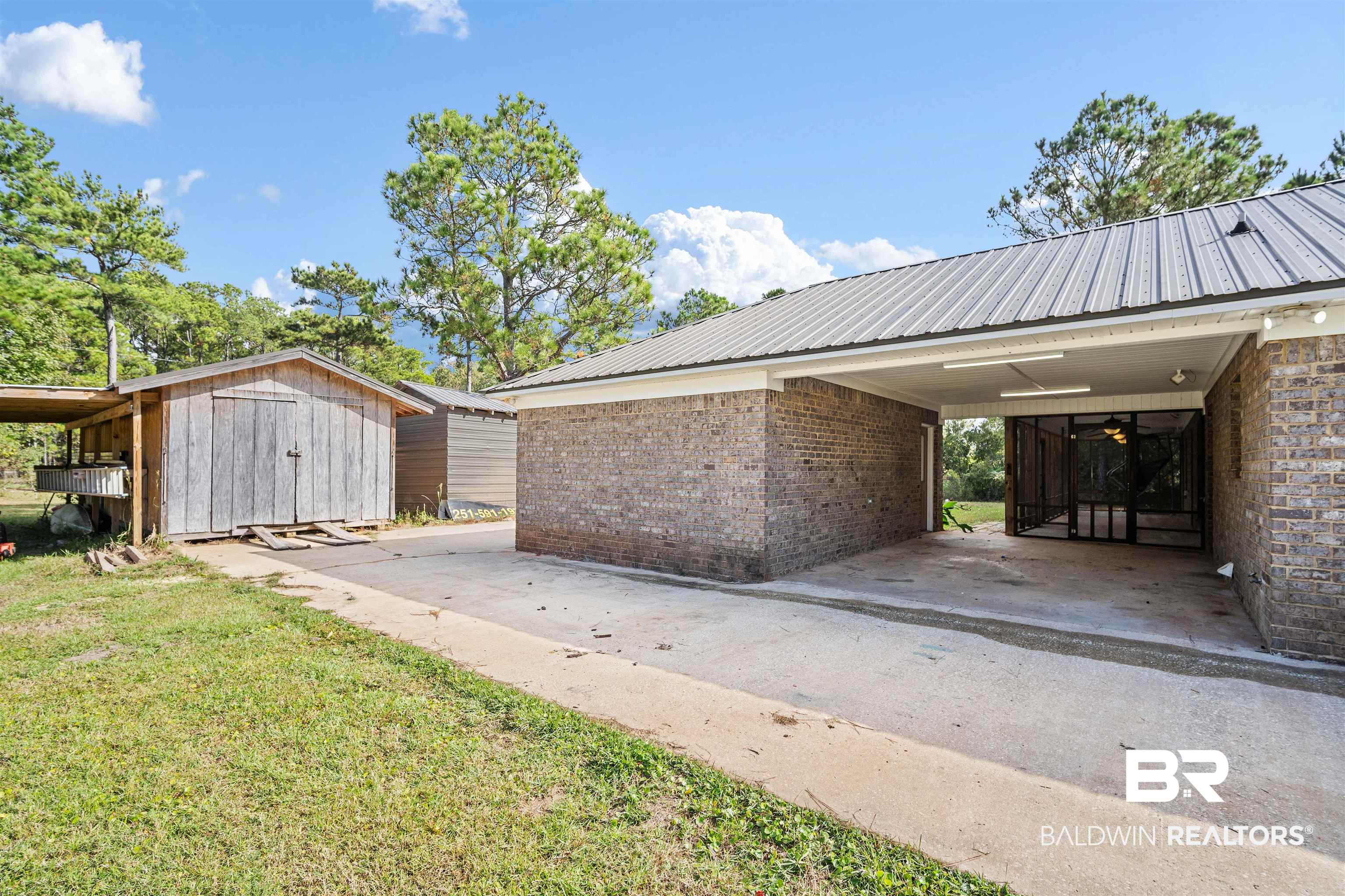 3010 Drag Strip Lane Coden, AL 36523 - Photo 32 of 44 View of home's exterior with a shed and a yard