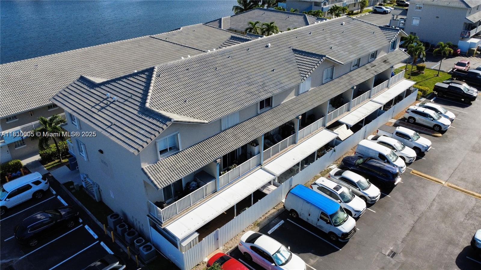 8360 Northwest 103rd Street, Unit 207E Hialeah Gardens, FL 33016 - Photo 11 of 25 an aerial view of a house