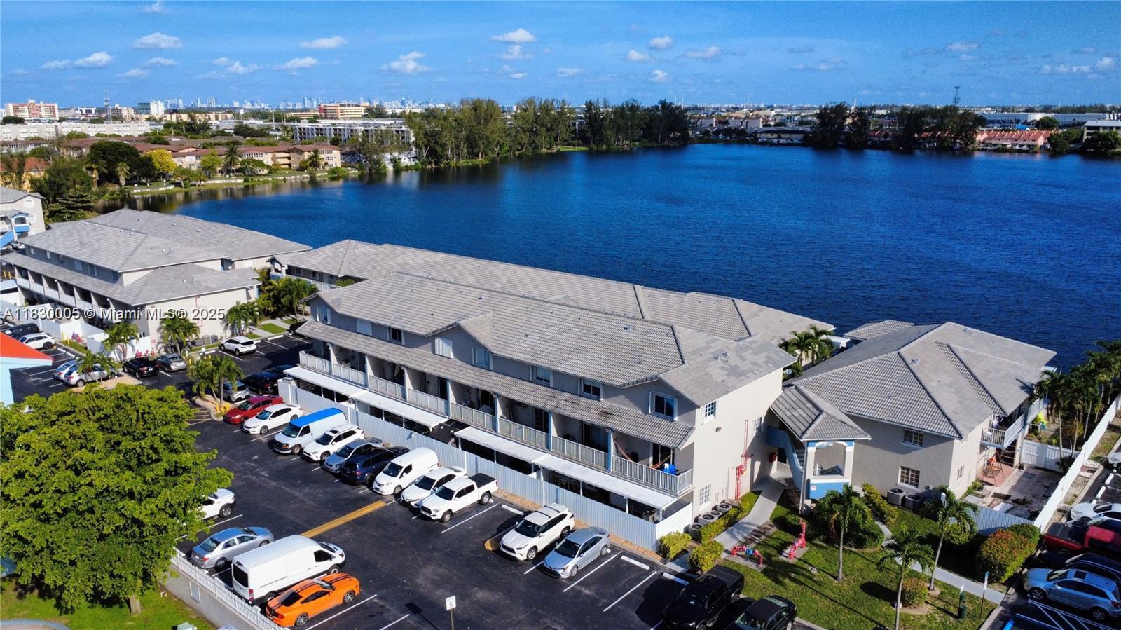 8360 Northwest 103rd Street, Unit 207E Hialeah Gardens, FL 33016 - Photo 2 of 25 an aerial view of a house with a lake view