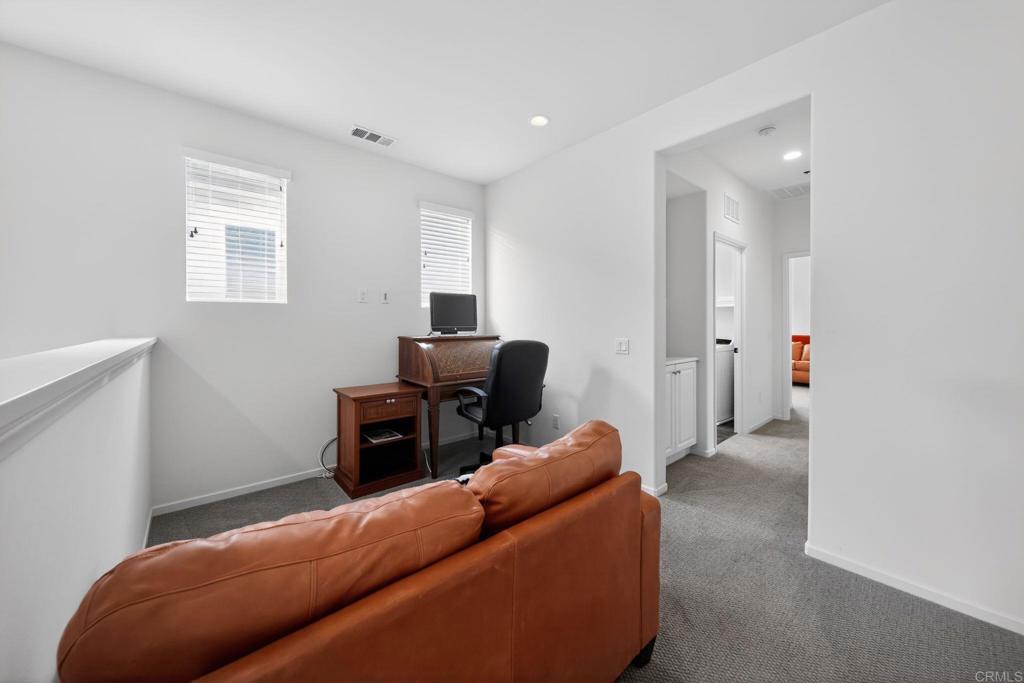 21641 Trail Ridge Drive Escondido, CA 92029 - Photo 15 of 43 a living room with furniture and a flat screen tv