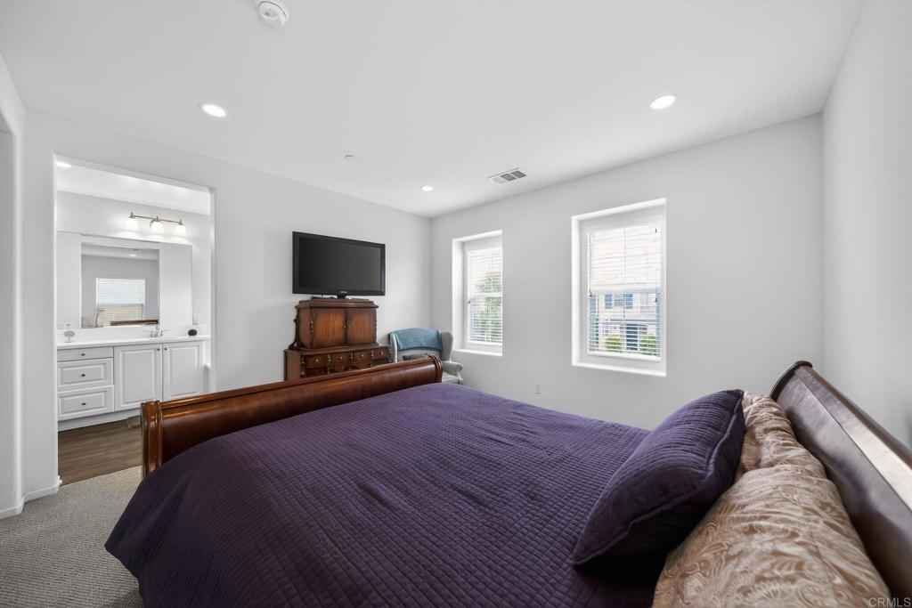 21641 Trail Ridge Drive Escondido, CA 92029 - Photo 17 of 43 a bedroom with a large bed and a tv