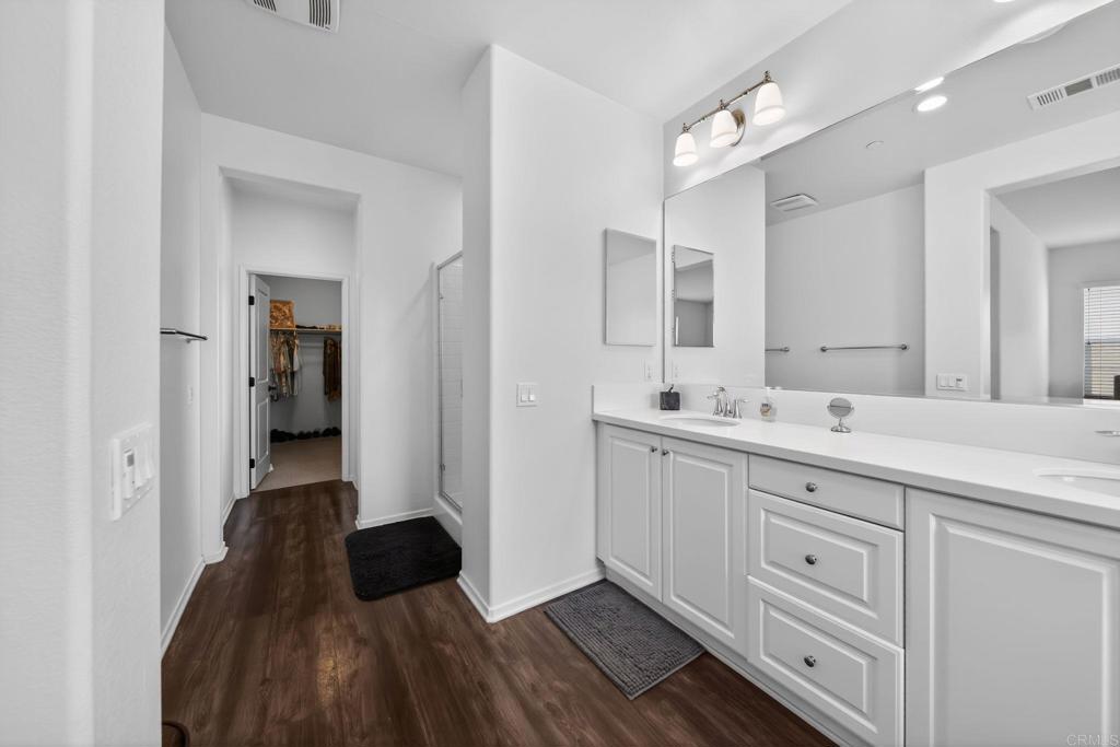 21641 Trail Ridge Drive Escondido, CA 92029 - Photo 20 of 43 a spacious bathroom with a double vanity sink and a mirror