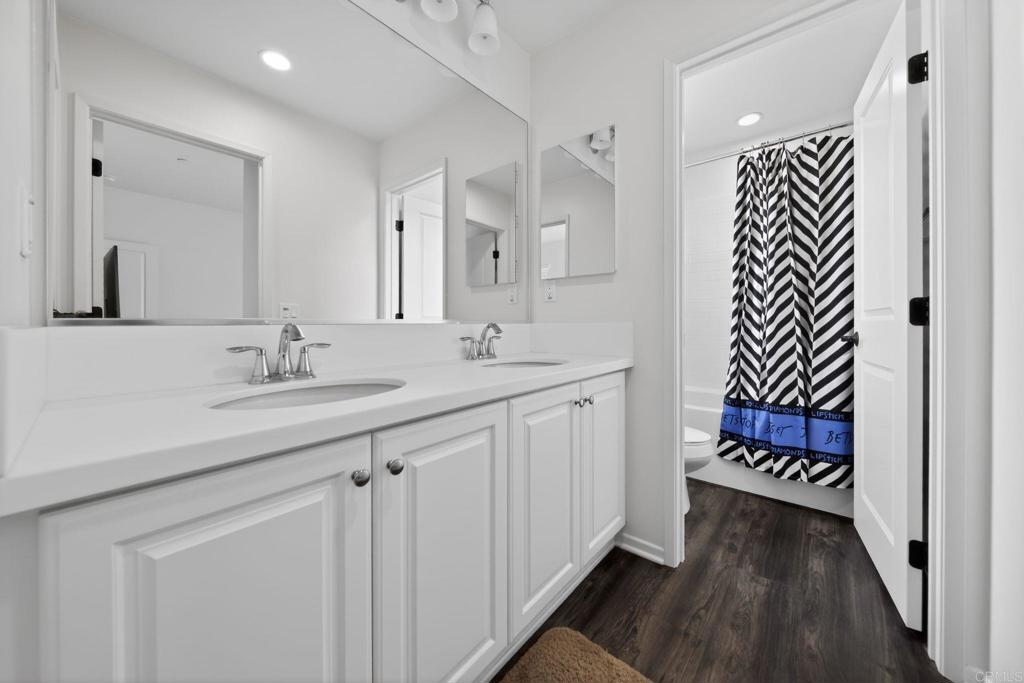 21641 Trail Ridge Drive Escondido, CA 92029 - Photo 23 of 43 a bathroom with a sink and a mirror
