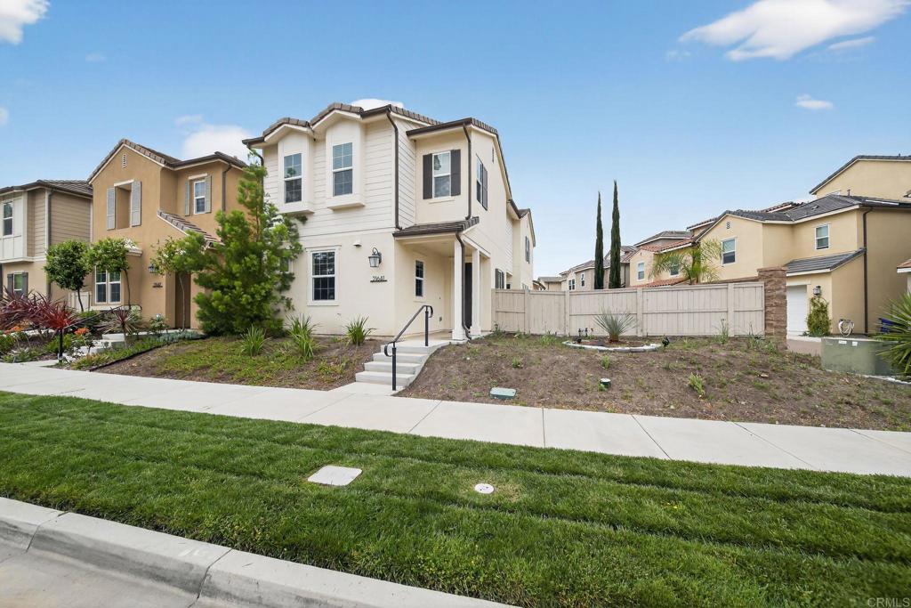 21641 Trail Ridge Drive Escondido, CA 92029 - Photo 38 of 43 a front view of a house with a yard