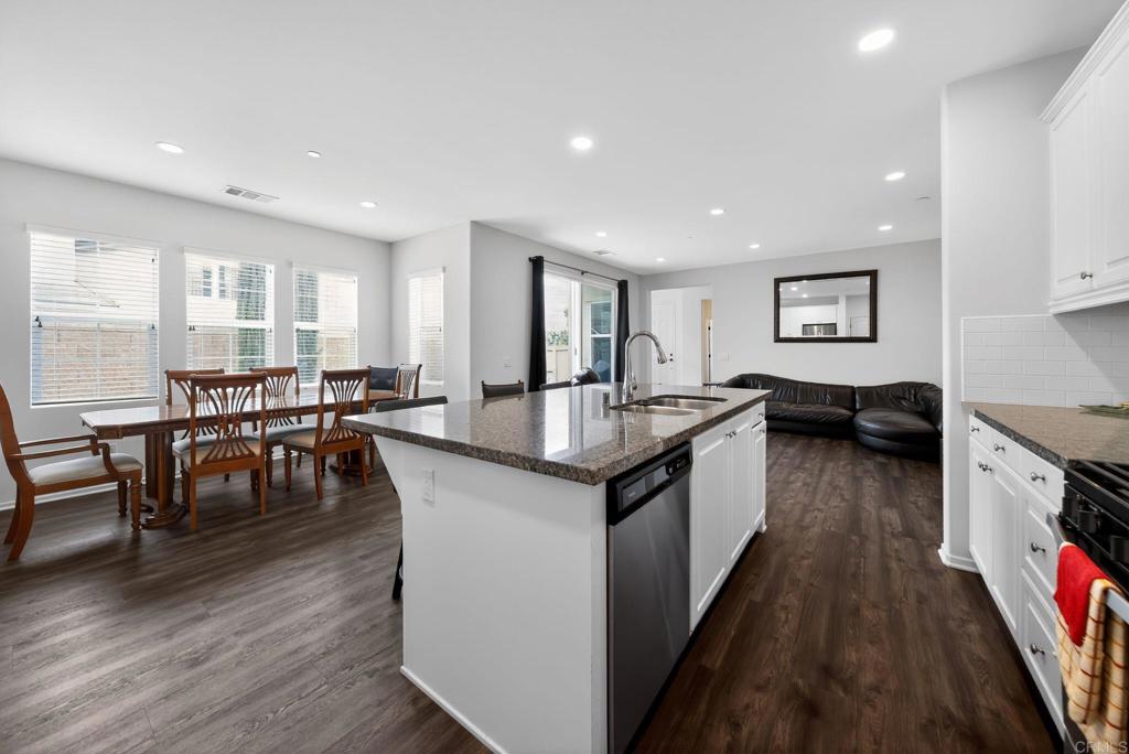21641 Trail Ridge Drive Escondido, CA 92029 - Photo 4 of 43 a kitchen with granite countertop lots of counter top space and living room