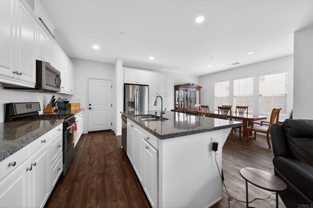 21641 Trail Ridge Drive Escondido, CA 92029 - Photo 6 of 43 a kitchen with granite countertop a sink and counter top space