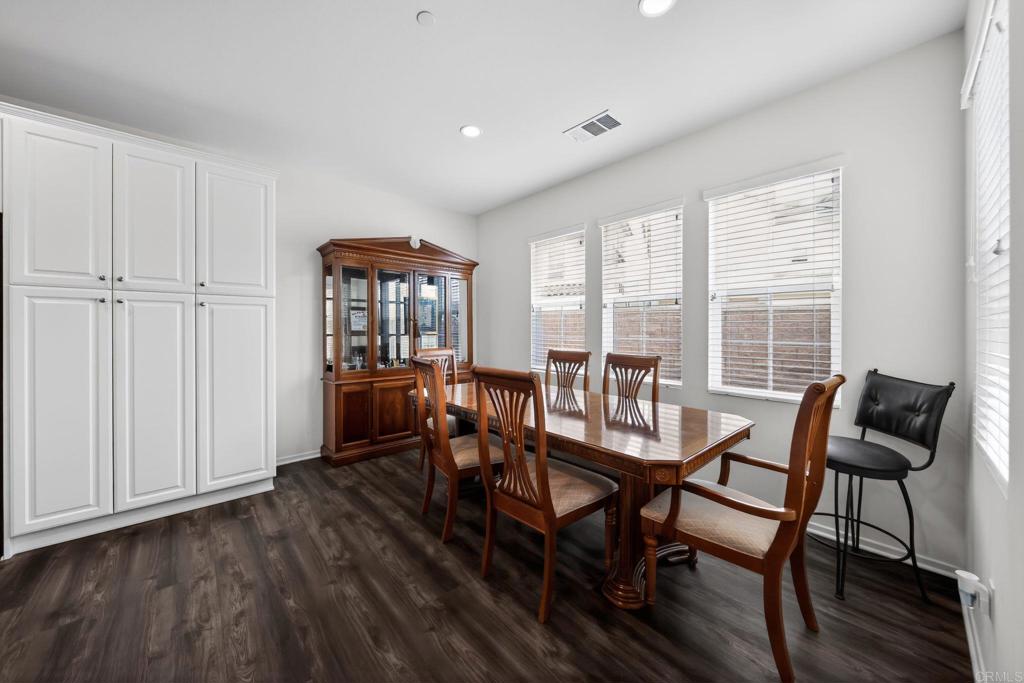 21641 Trail Ridge Drive Escondido, CA 92029 - Photo 8 of 43 a view of a dining room with furniture and wooden floor
