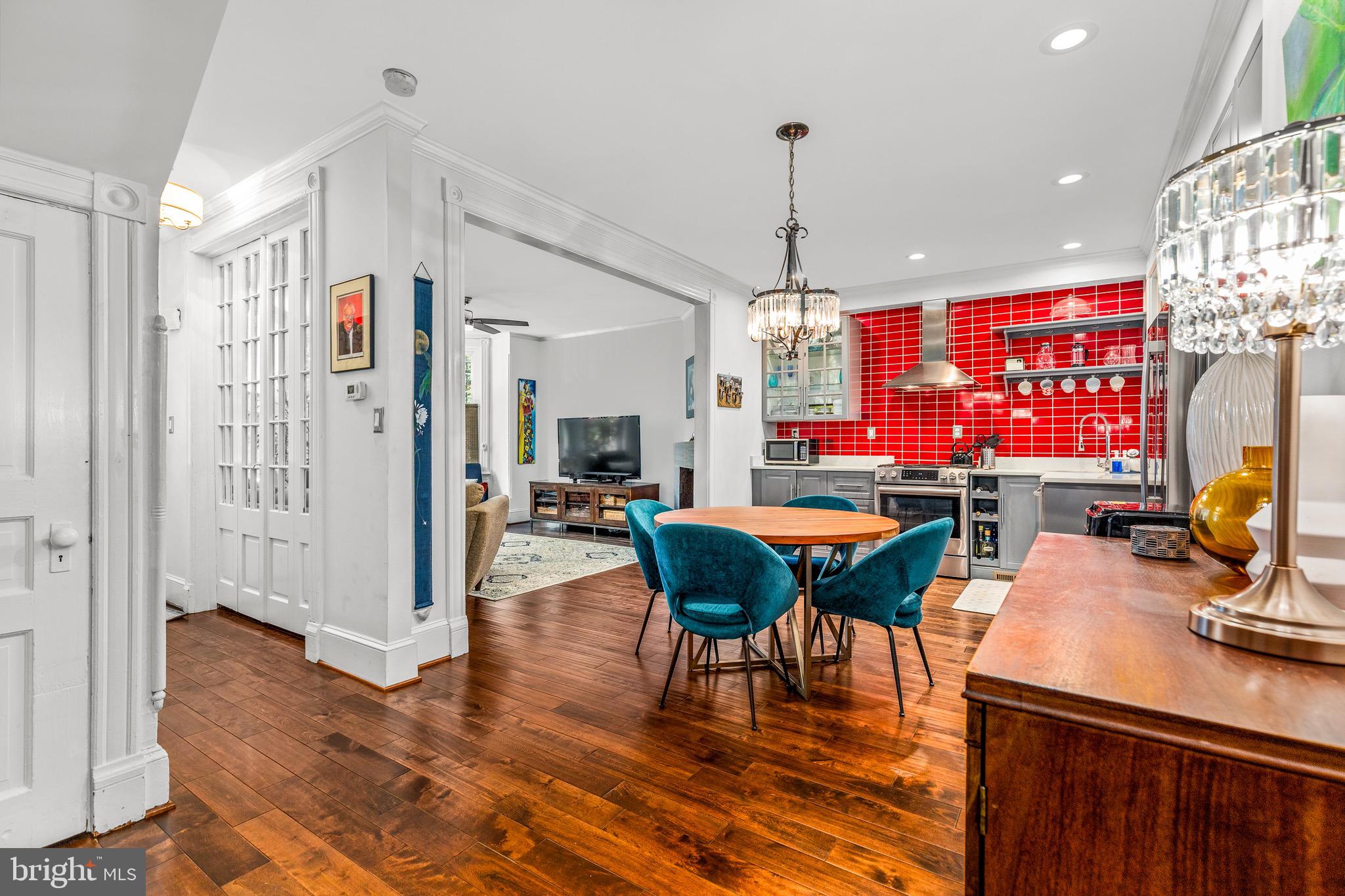 502 G Street Northeast Washington, DC 20002 - Photo 11 of 39 a dining room with furniture a chandelier and wooden floor