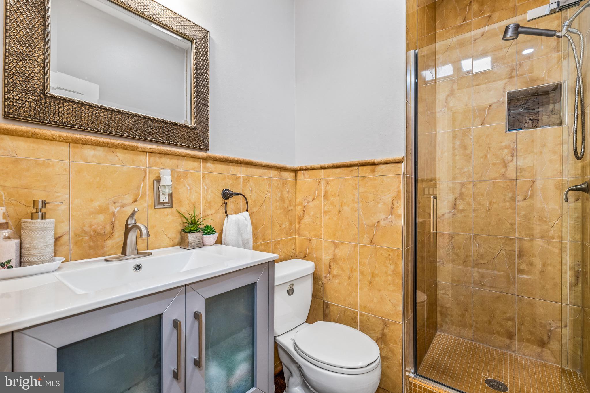 502 G Street Northeast Washington, DC 20002 - Photo 12 of 39 a bathroom with a sink a toilet and shower