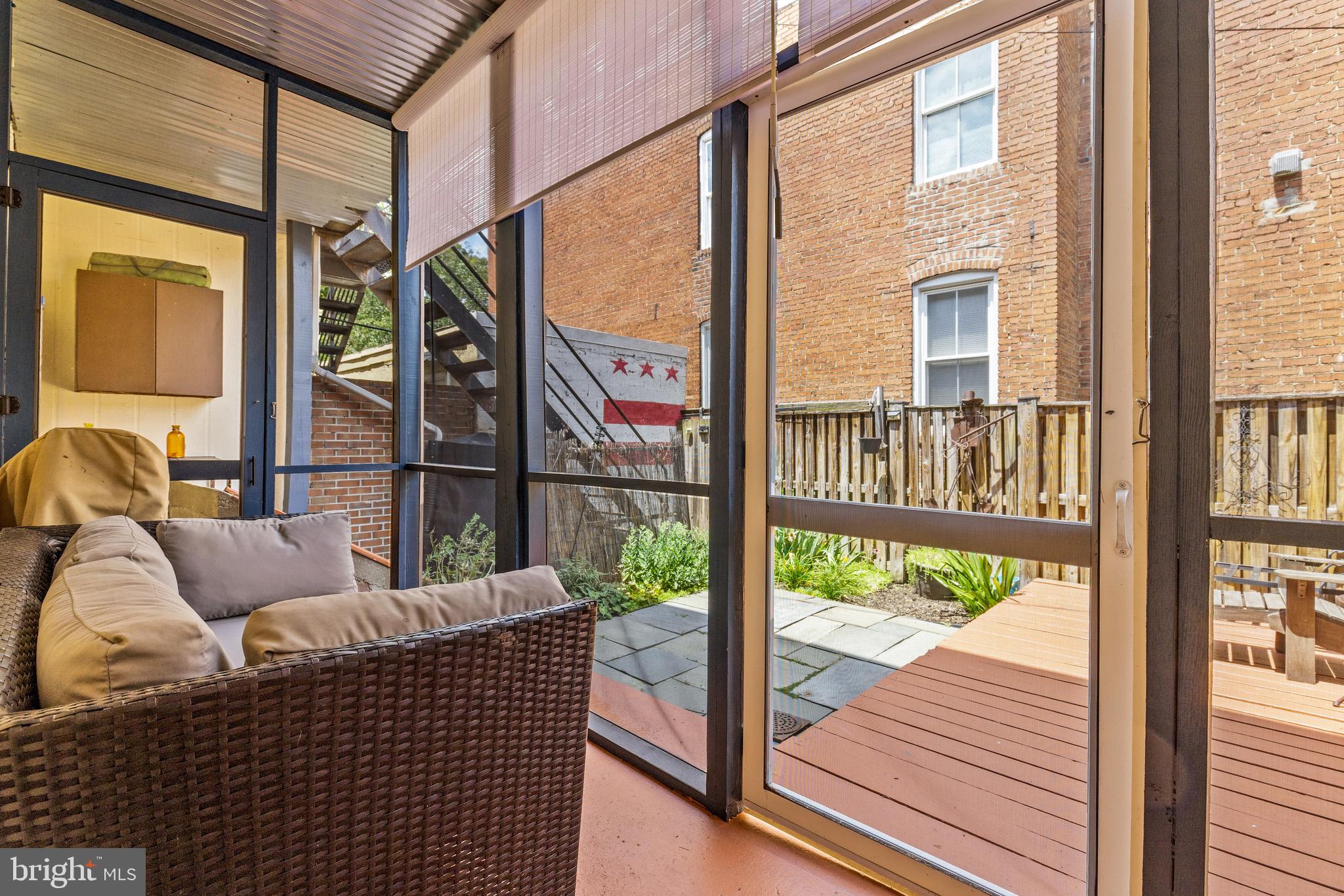 502 G Street Northeast Washington, DC 20002 - Photo 19 of 39 a balcony with wooden floor and outdoor seating