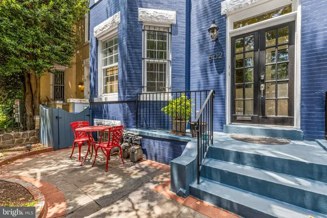 a backyard of a house with seating space