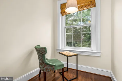 a view of a chair and table in a room