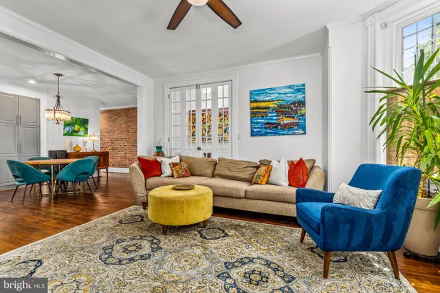 a living room with furniture and a rug
