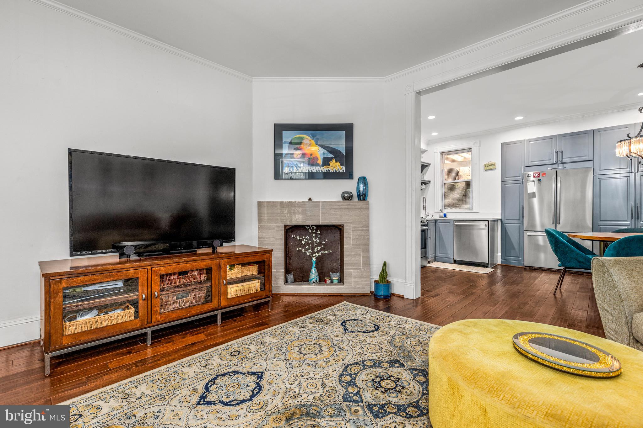 502 G Street Northeast Washington, DC 20002 - Photo 10 of 39 a living room with furniture and a flat screen tv