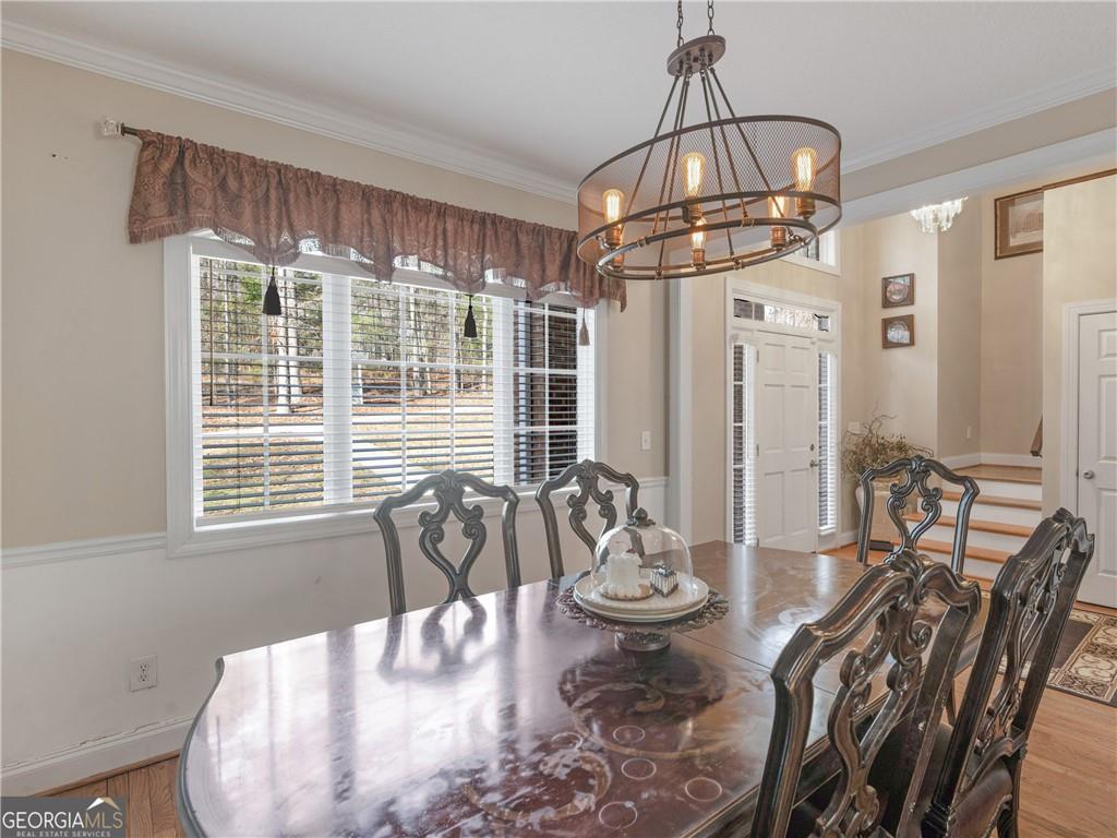 355 Parker Road Covington, GA 30014 - Photo 17 of 60 a view of a dining room with furniture window and outside view