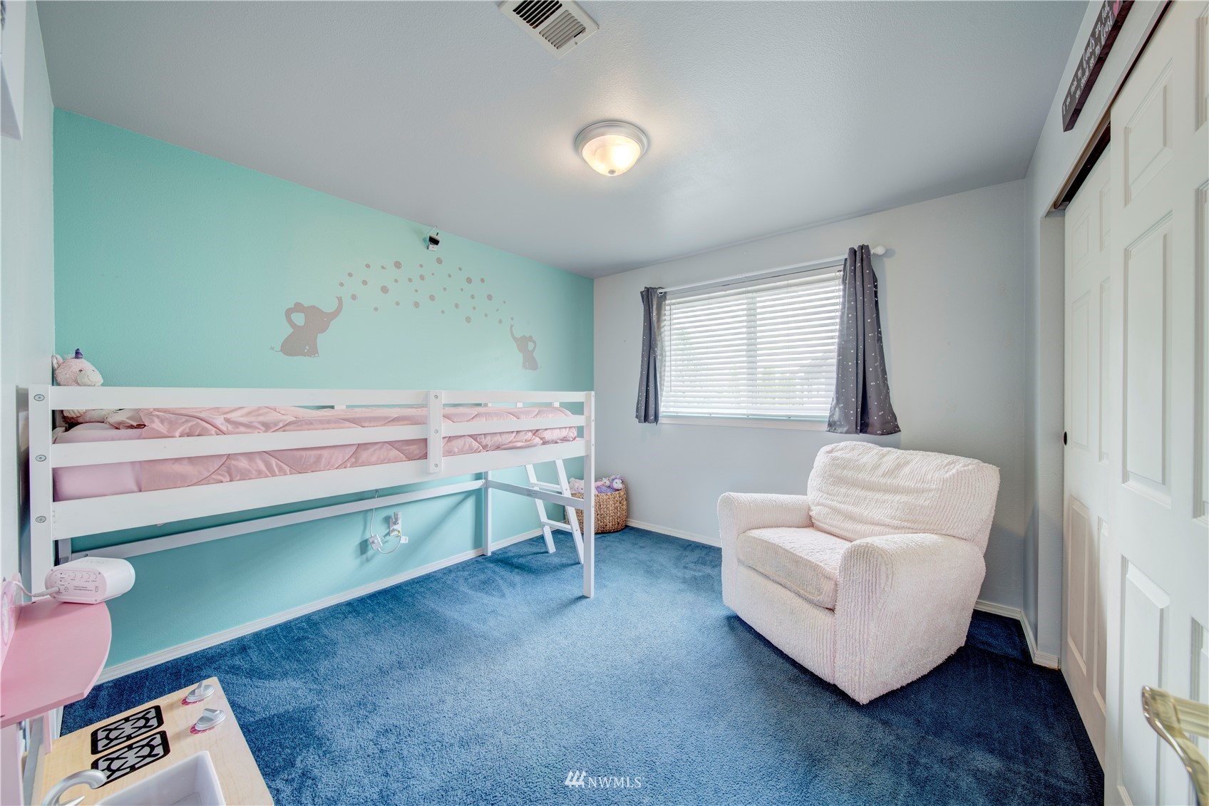 6018 Lowell Road Everett, WA 98203 - Photo 11 of 21 a bedroom with a bed and a couch