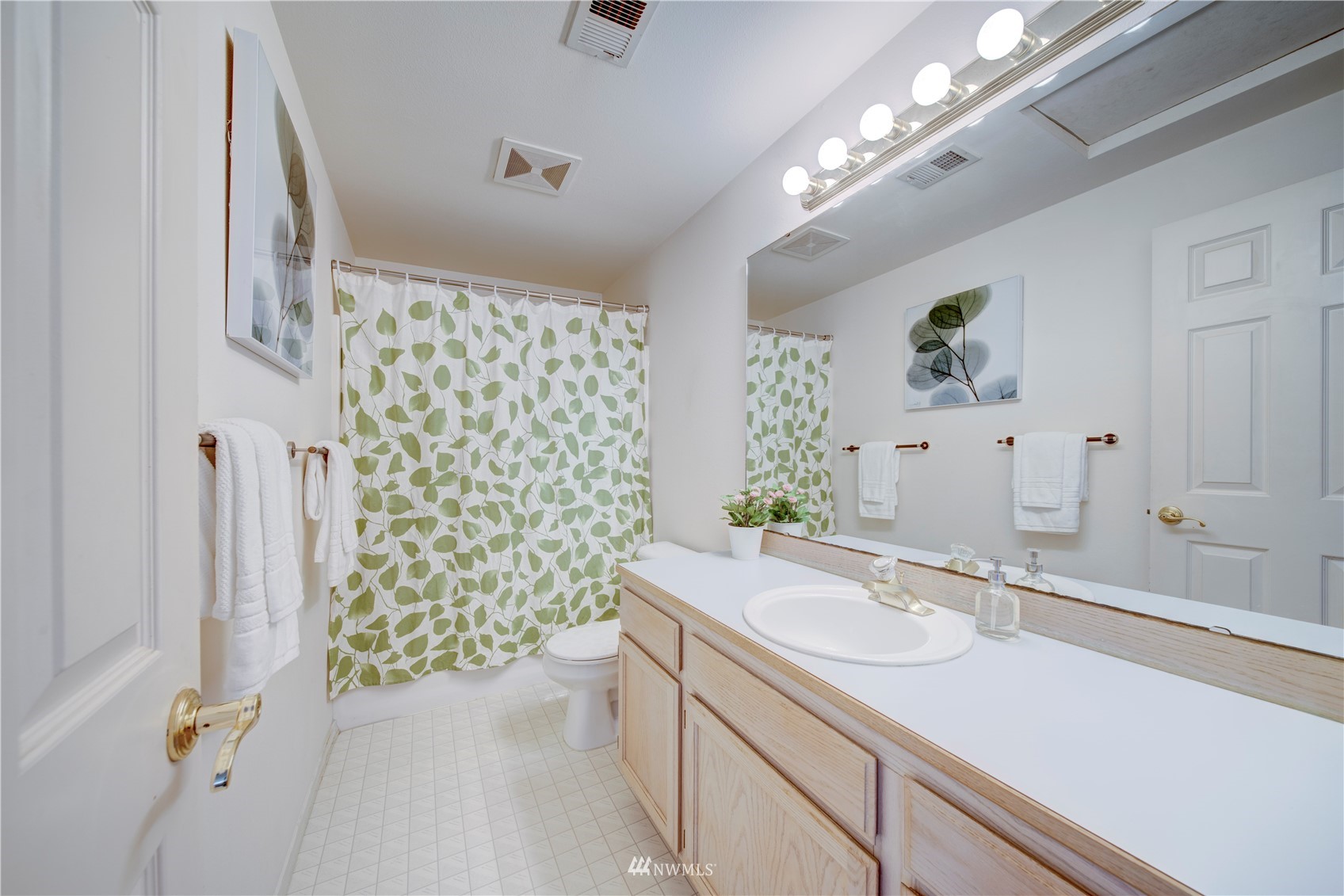 6018 Lowell Road Everett, WA 98203 - Photo 13 of 21 a bathroom with a sink double vanity and a shower
