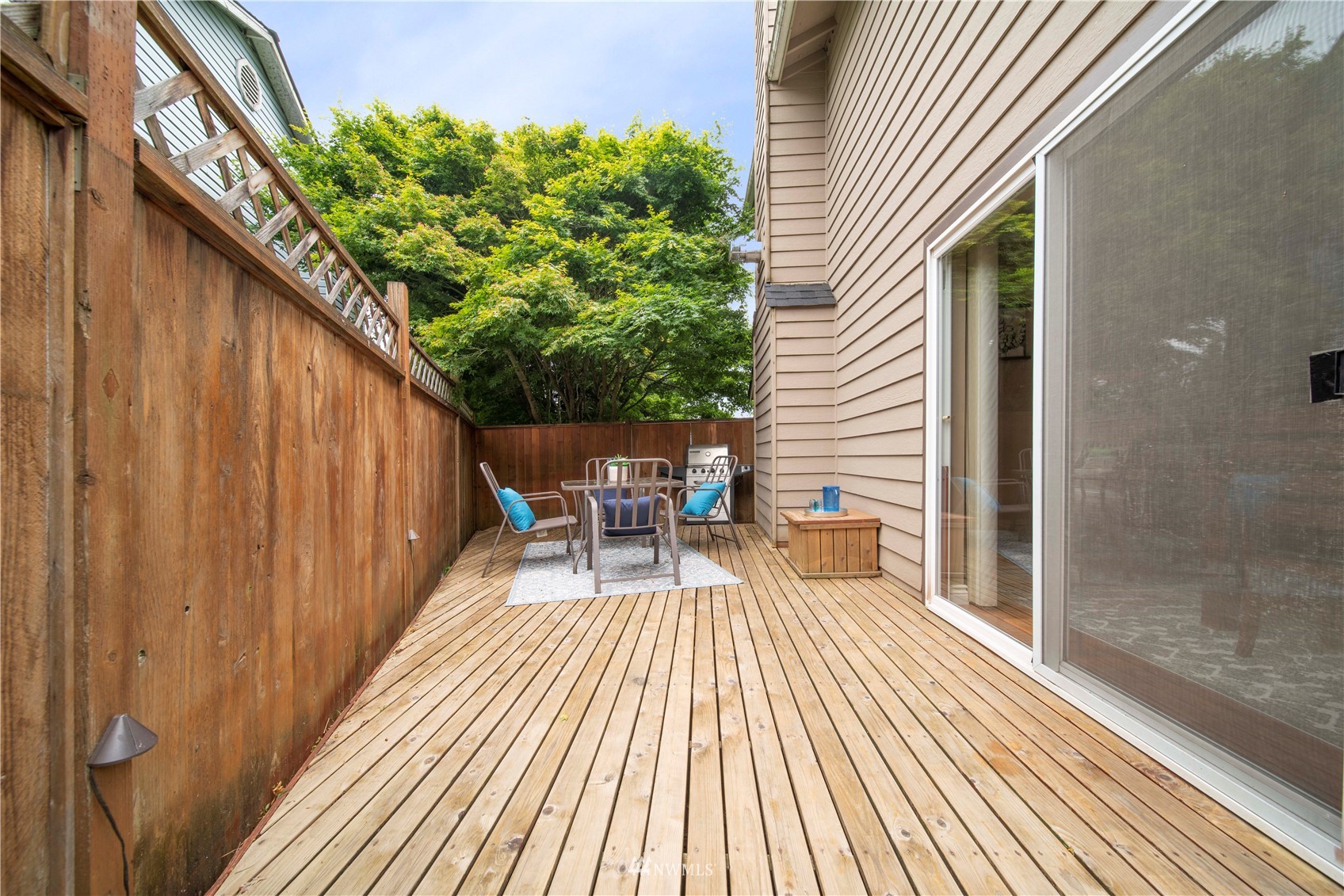 6018 Lowell Road Everett, WA 98203 - Photo 16 of 21 a balcony with wooden floor table and chairs