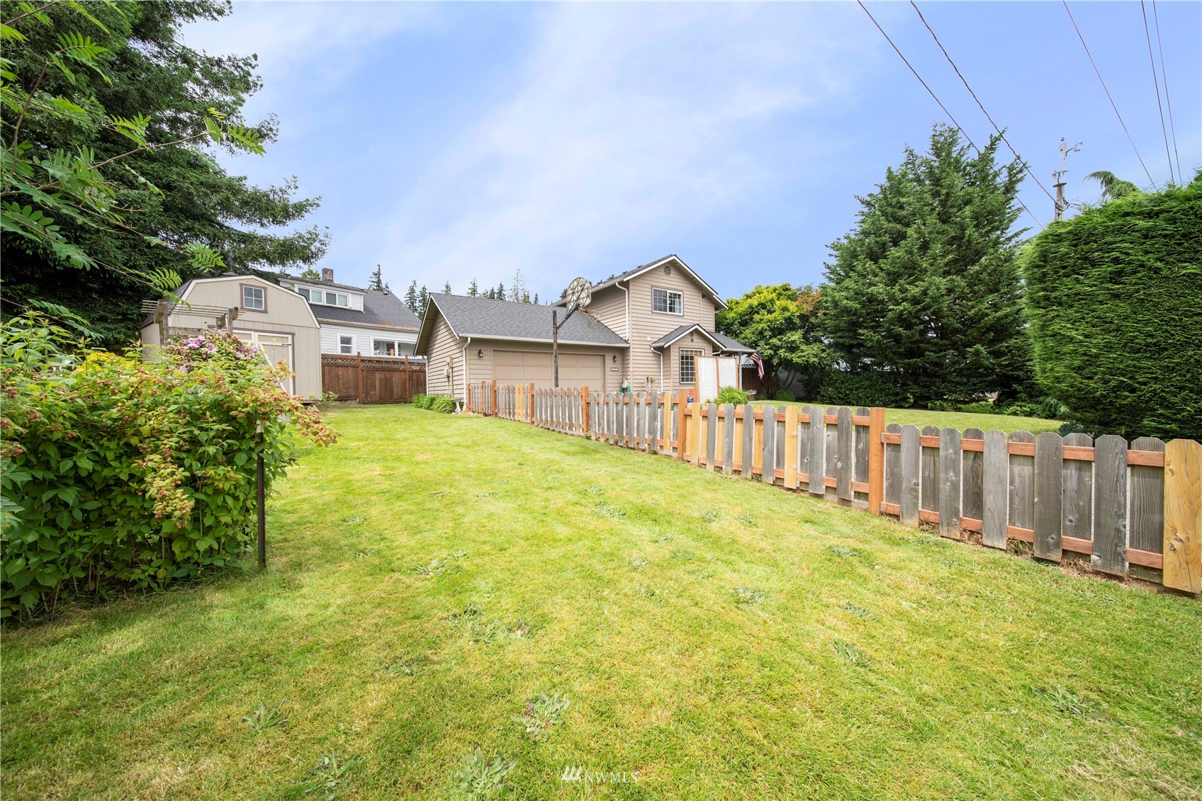 6018 Lowell Road Everett, WA 98203 - Photo 19 of 21 a view of a house with wooden fence