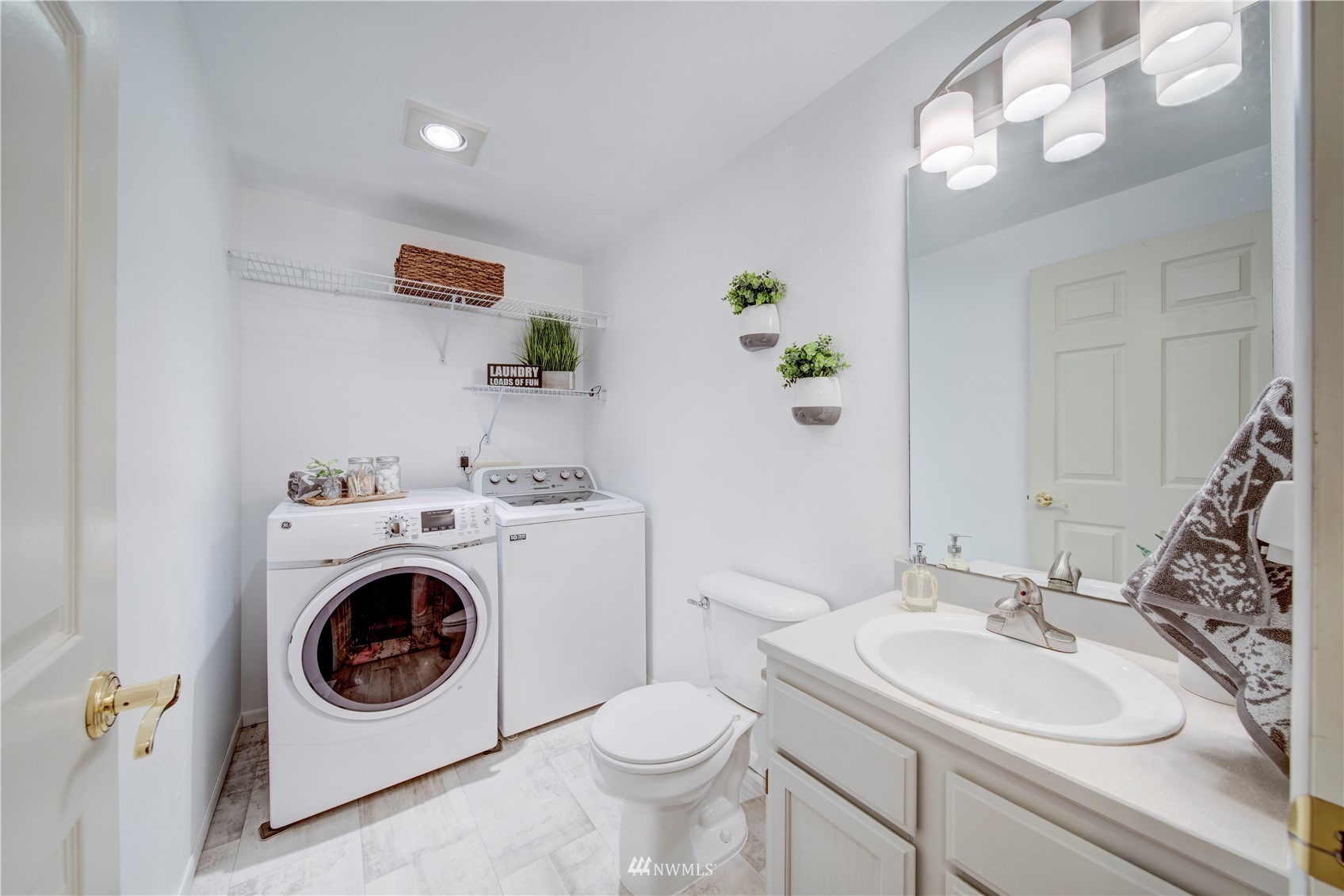 6018 Lowell Road Everett, WA 98203 - Photo 4 of 21 a bathroom with a sink and a washer dryer