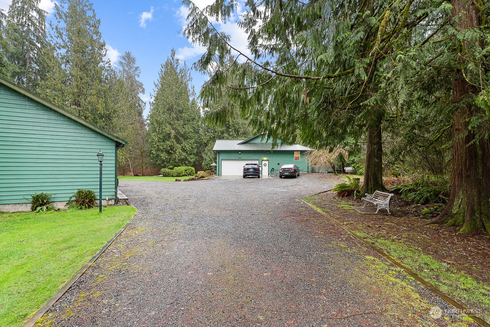 19618 Jordan Road Arlington, WA 98223 - Photo 11 of 32 a view of a house with backyard and a tree