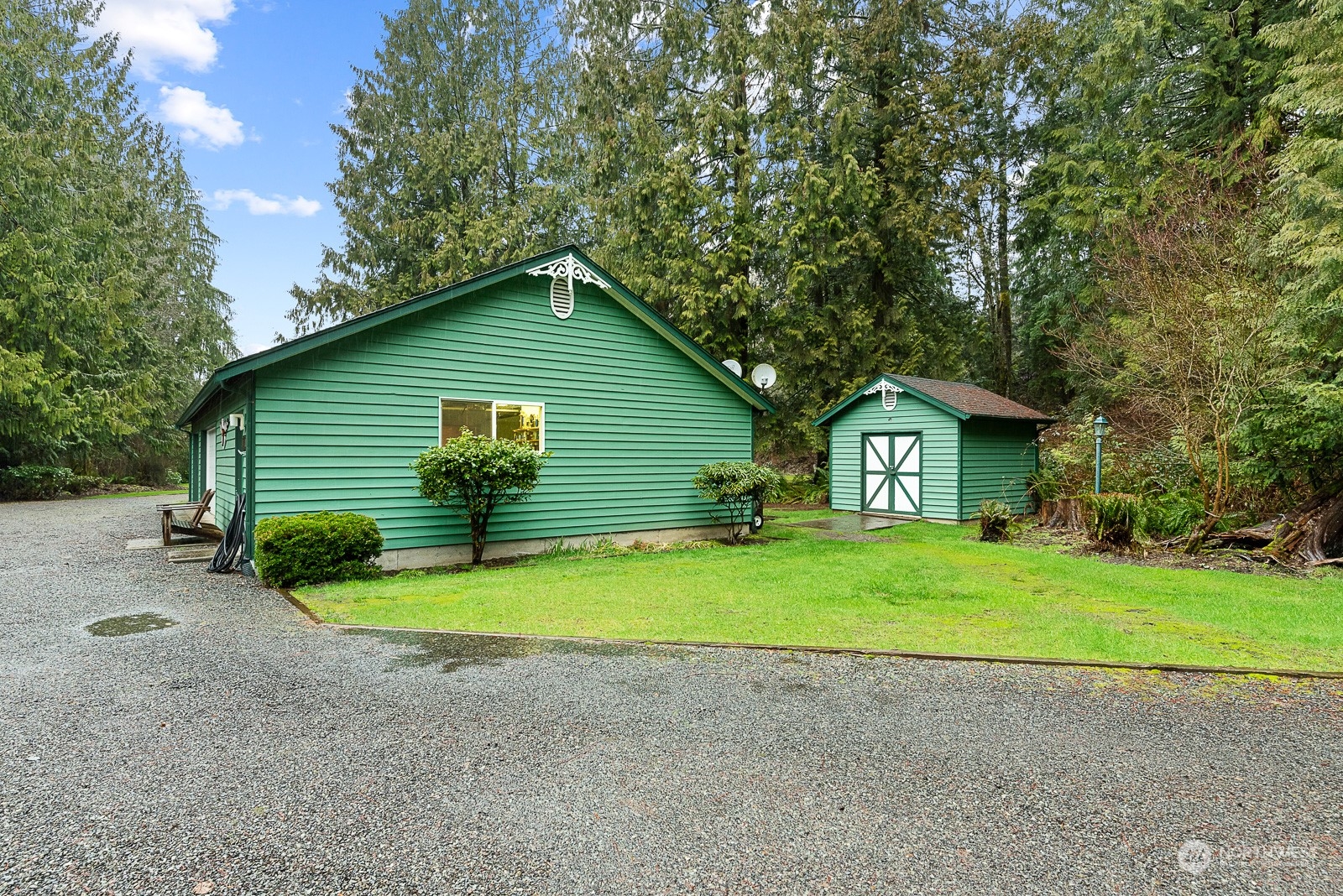 19618 Jordan Road Arlington, WA 98223 - Photo 12 of 32 a view of a house with backyard and trees