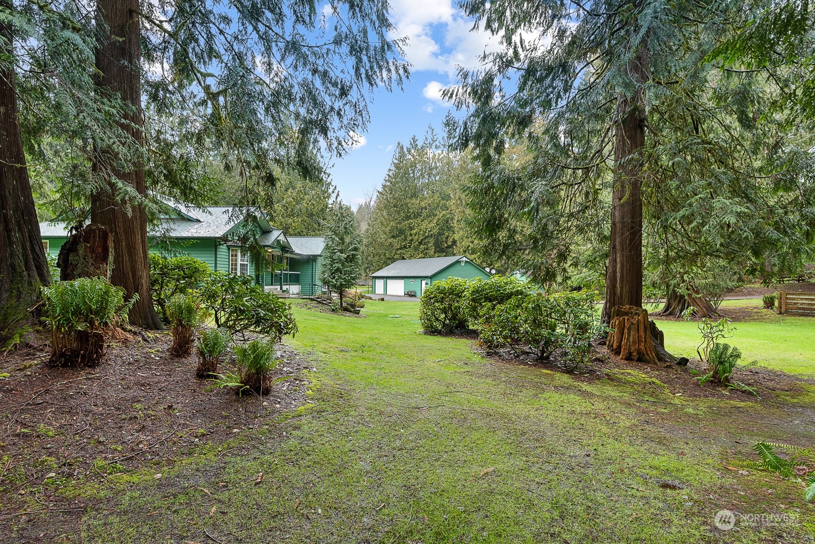 19618 Jordan Road Arlington, WA 98223 - Photo 13 of 32 a view of a garden with large trees