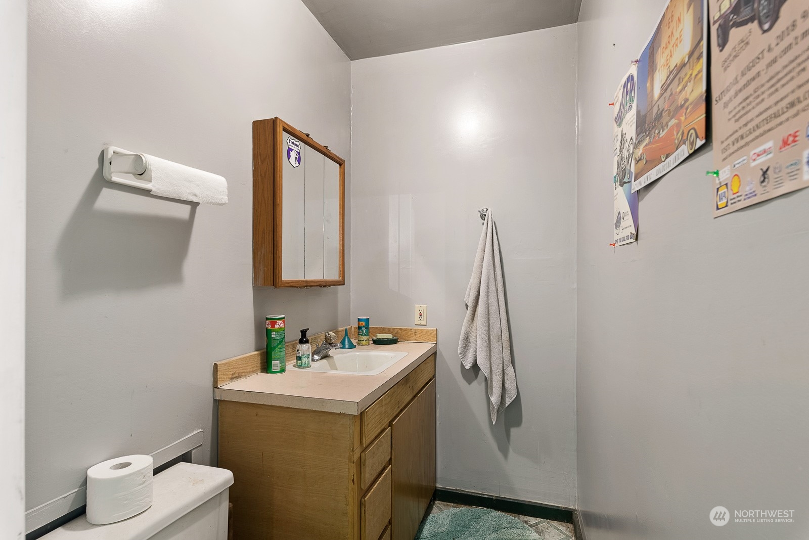 19618 Jordan Road Arlington, WA 98223 - Photo 14 of 32 a bathroom with a granite countertop sink and a mirror