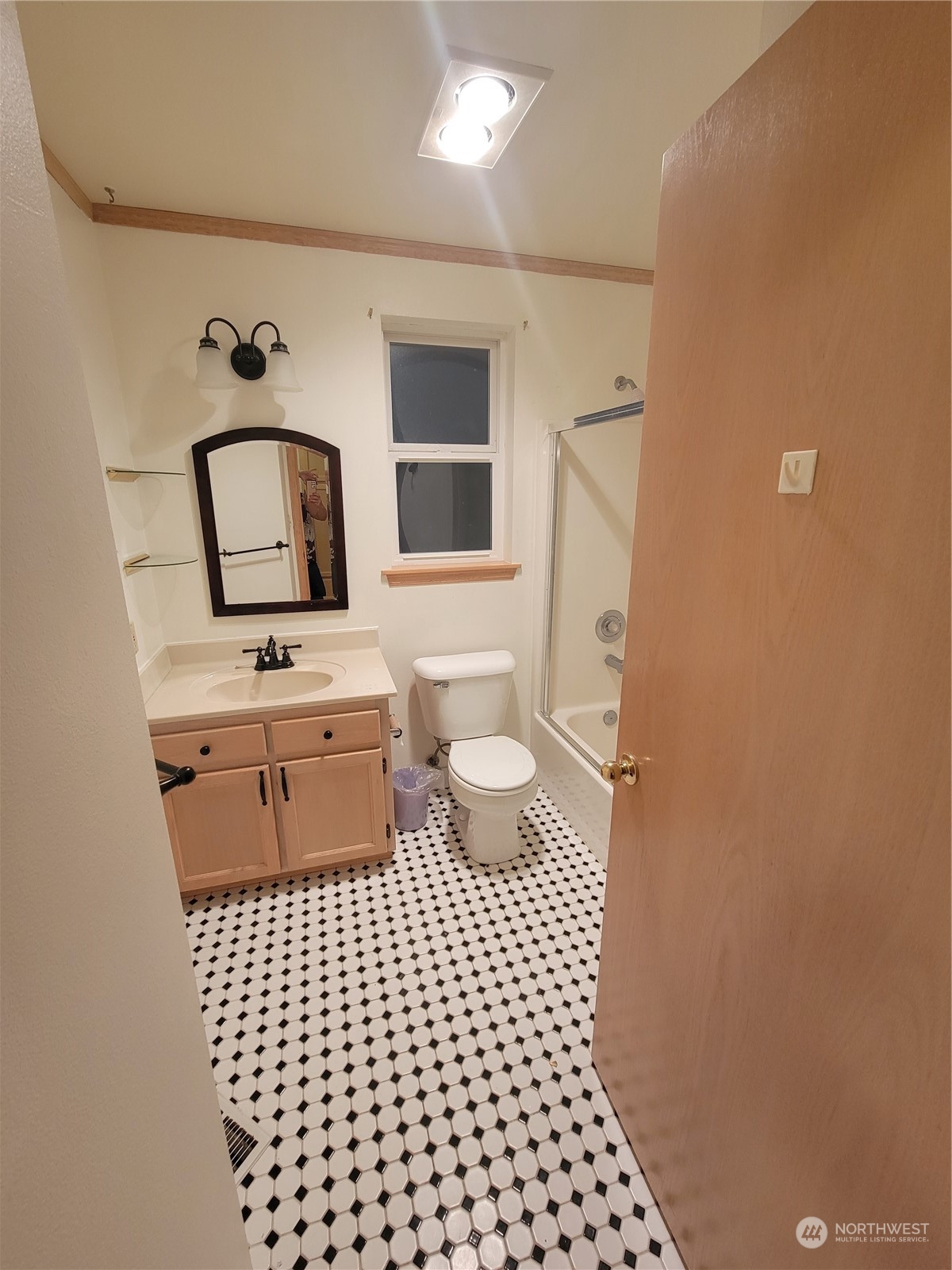 19618 Jordan Road Arlington, WA 98223 - Photo 16 of 32 a bathroom with a toilet a sink and mirror
