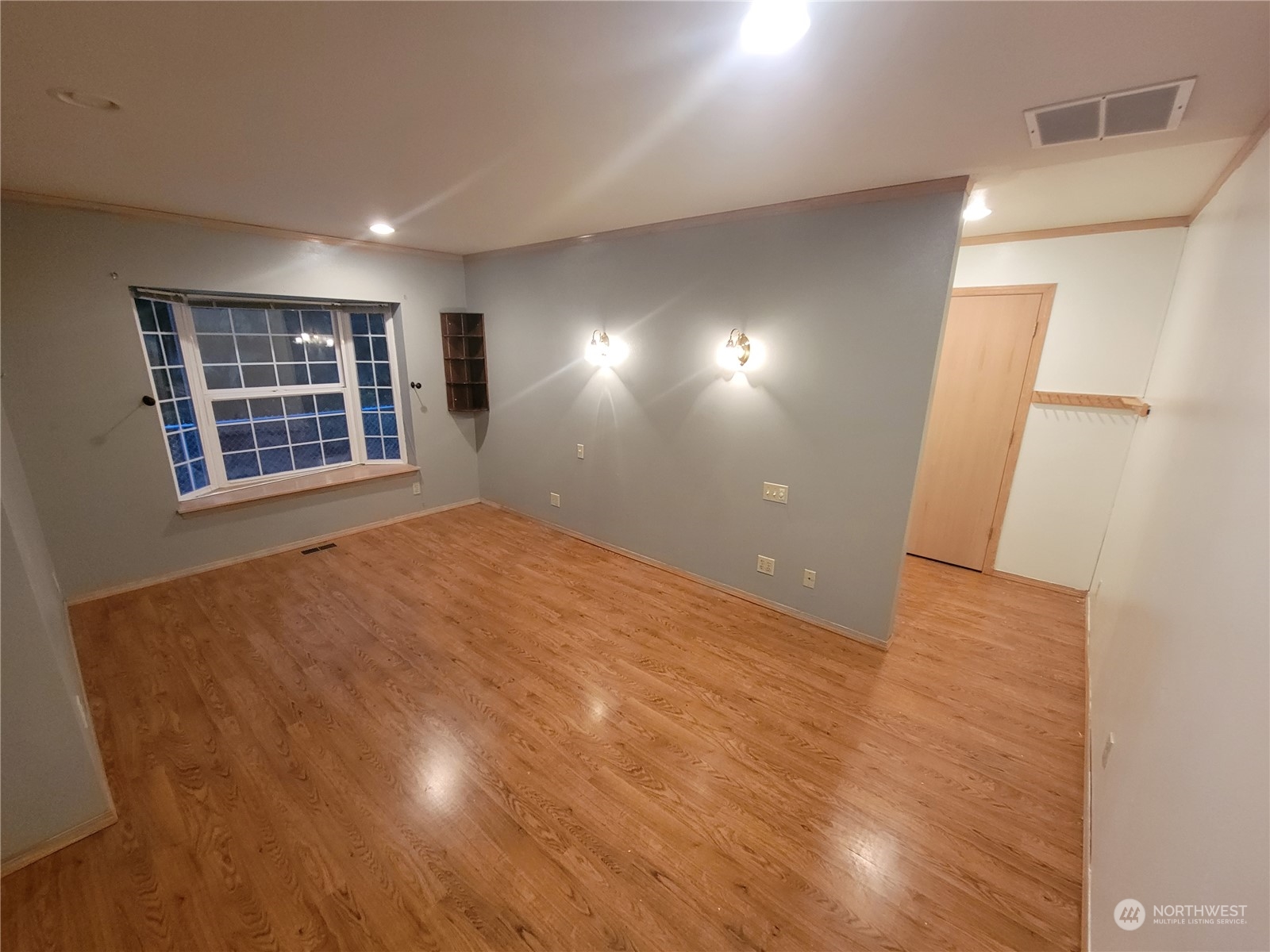 19618 Jordan Road Arlington, WA 98223 - Photo 17 of 32 a view of an empty room with wooden floor and windows