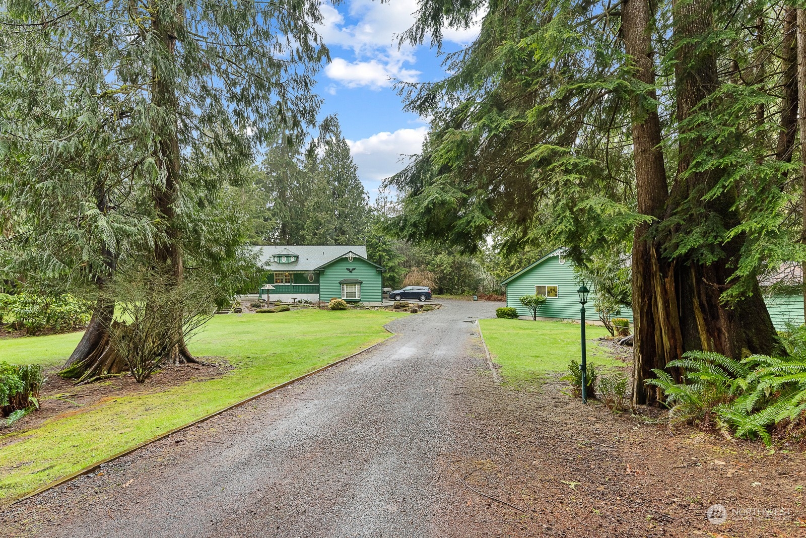19618 Jordan Road Arlington, WA 98223 - Photo 2 of 32 a green field with some trees in the background