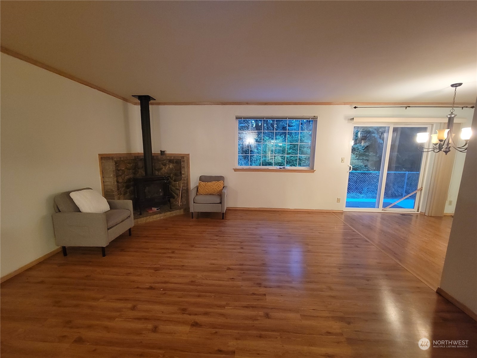 19618 Jordan Road Arlington, WA 98223 - Photo 27 of 32 a view of empty room with wooden floor and fan