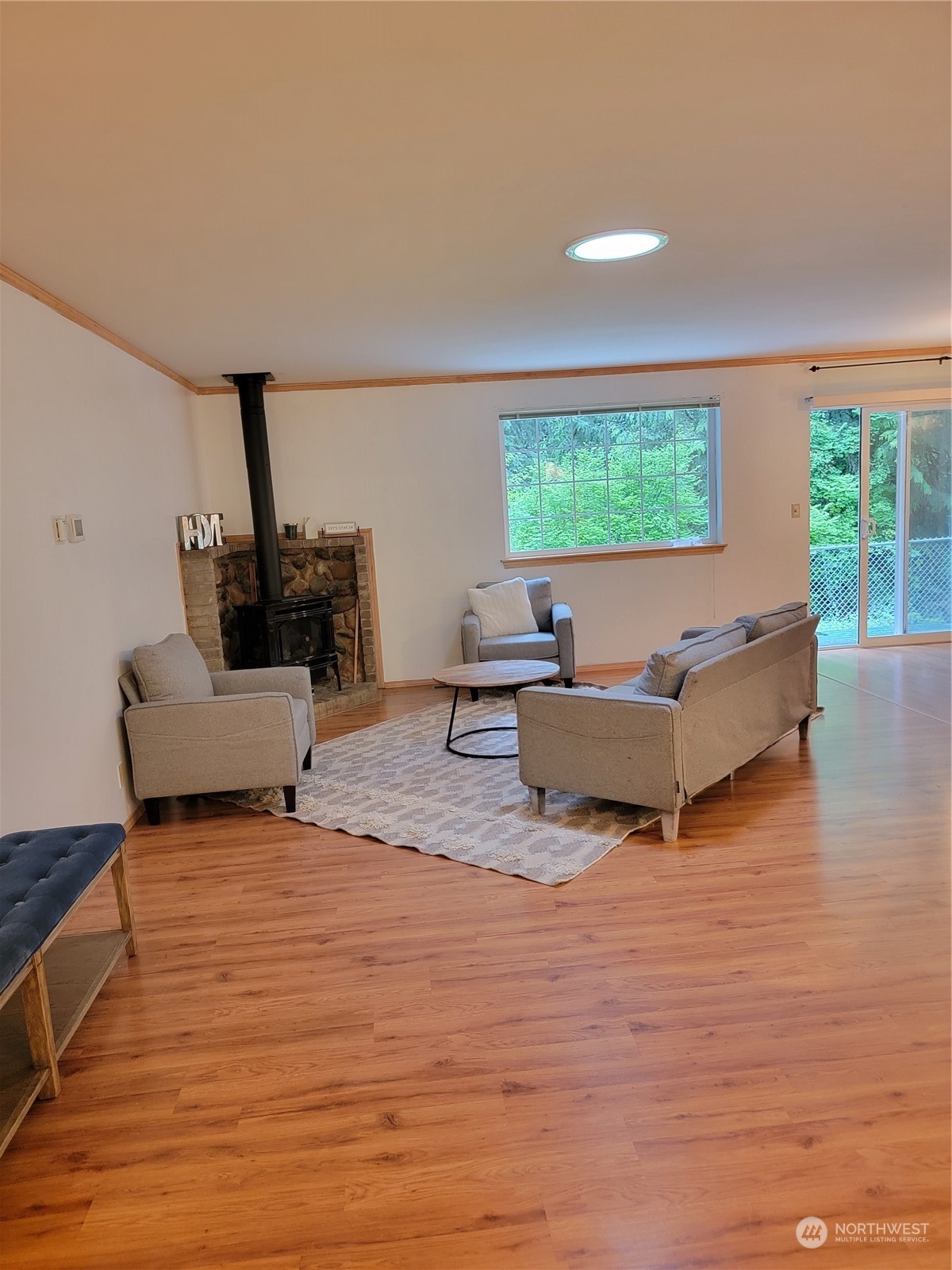19618 Jordan Road Arlington, WA 98223 - Photo 29 of 32 a living room with furniture and a flat screen tv