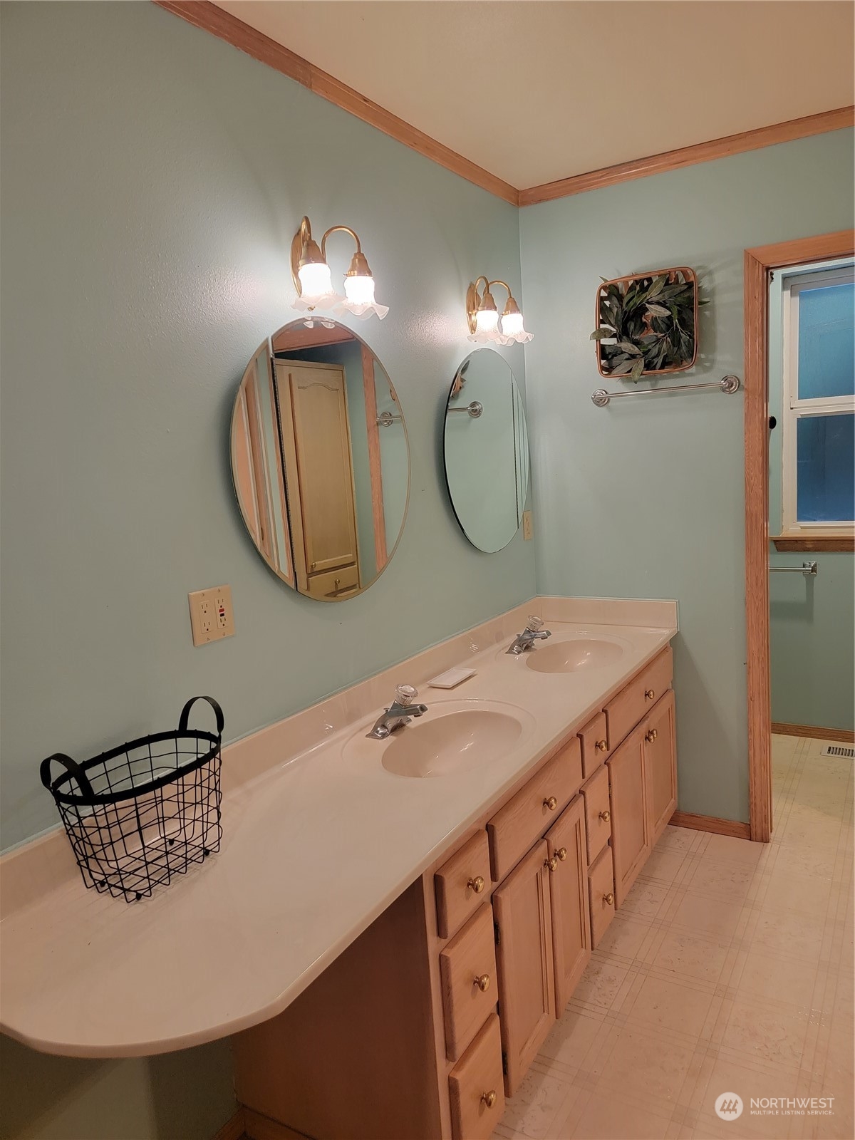 19618 Jordan Road Arlington, WA 98223 - Photo 31 of 32 a bathroom with a double vanity sink and a mirror